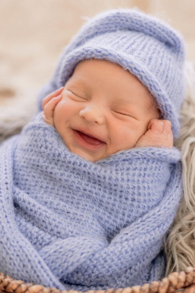 Swaddled baby with soft light at Downtown Phoenix studio during newborn photography photo session.