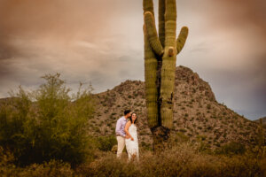 photo of elopement wedding couple with mountains and cactus in background