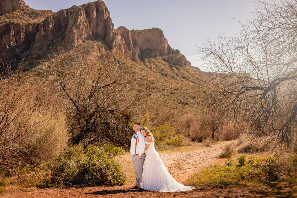 bride and groom wedding photo in the sun at Water Users Recreation area at the Salt River in Mesa, AZ