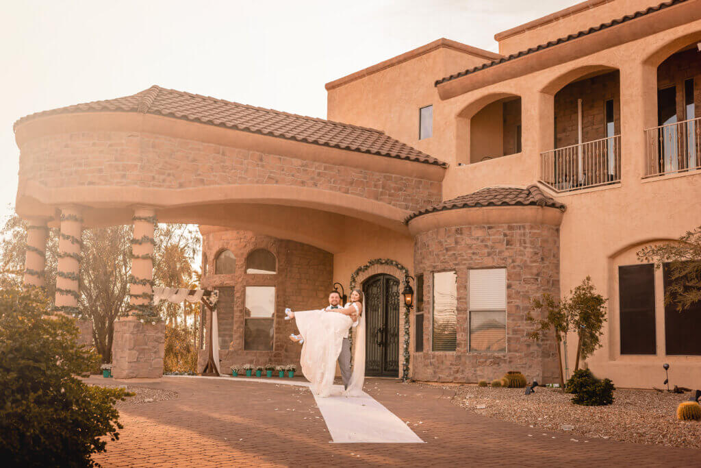 Wedding couple in frontyard in Mesa, AZ where their ceremony was held