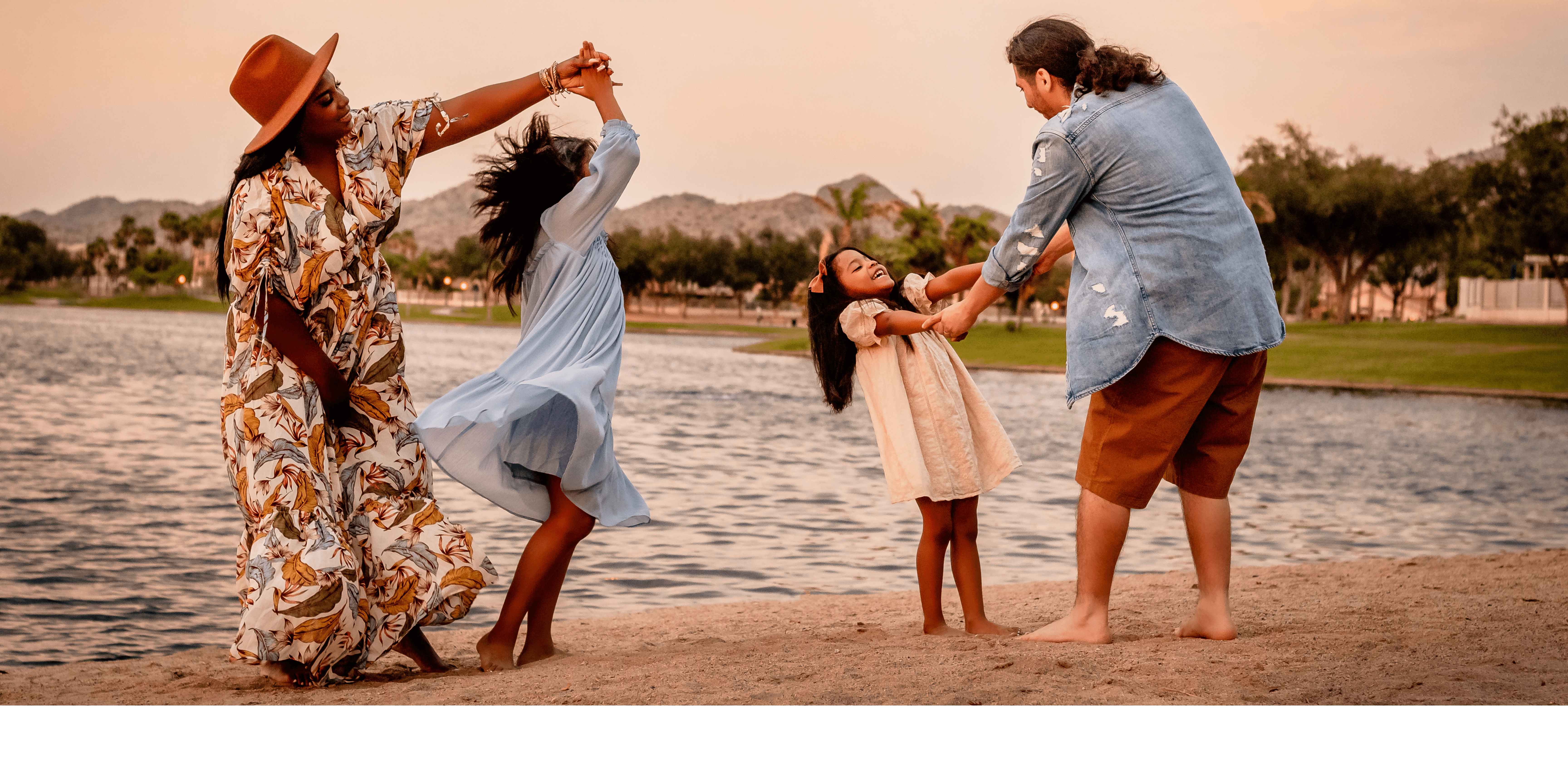 family photo of family dancing in Estrella Mountain in Goodyear, AZ by photographer Memories by Candace