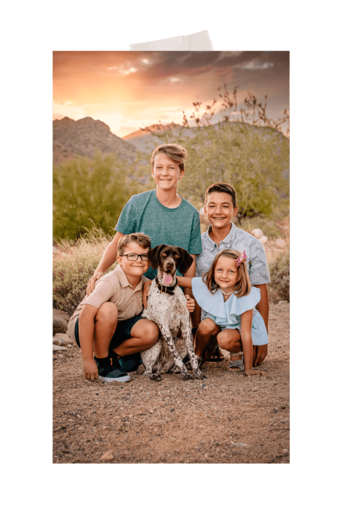 family photo at the White Tank Mountains at sunset with kids and a dog by photographer Memories by Candace