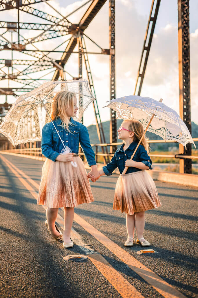 Sisters holding hand Gillespie Dam Bridge