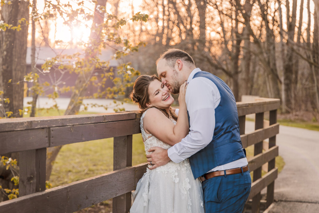 Photo of wedding couple on bridge at Douglas Walker Park in Byron Center Michigan