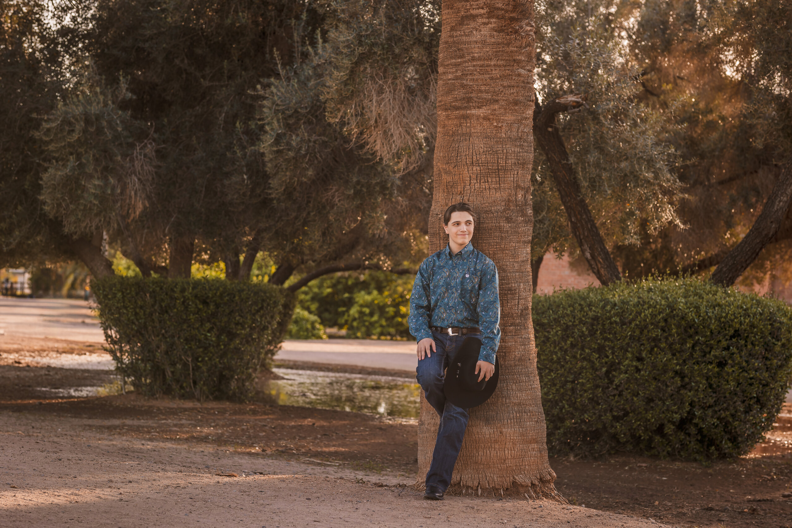 Green photography location in Glendale, Arizona stepping out of the Phoenix desert feel with Senior Photographer.