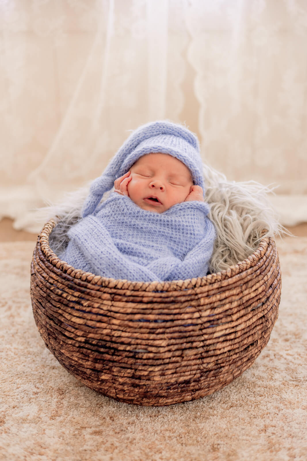 Swaddled baby with soft light at Downtown Phoenix studio during newborn photography photo session.