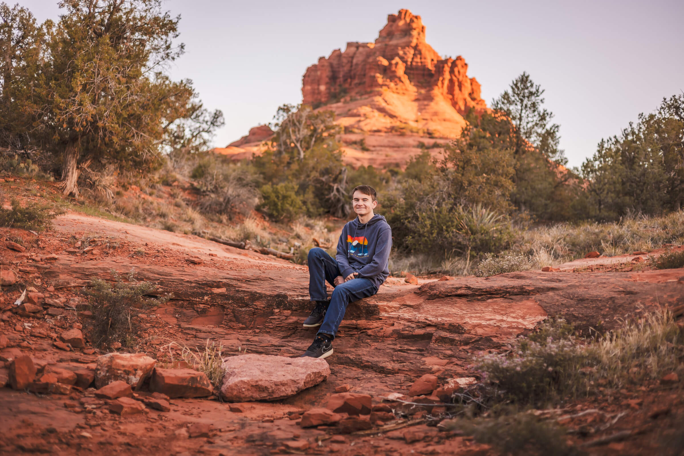 Bell Rock captured in the distance during Arizona senior portraits.