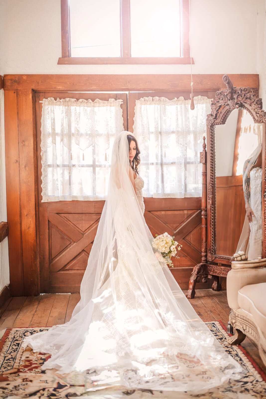 Bride photographed in soft natural light before her wedding ceremony