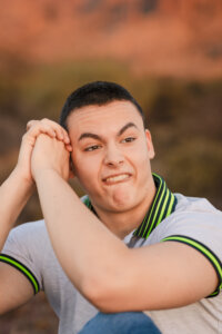 Pinnacle High School student making goofy face expression during Phoenix Senior portrait session.