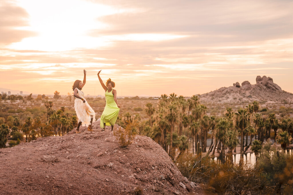 Phoenix photographer captures 2 women in their 40s celebrating womanhood and empowerment and friendship at sunset in the desert.