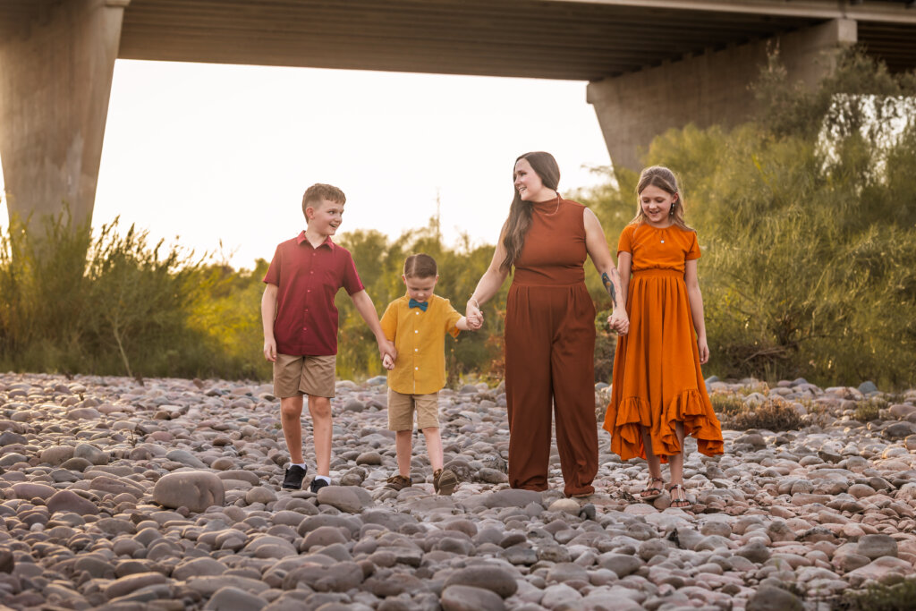 Phoenix-Family-Photographer-6 Mother walking with her kids on rocks, captured by Phoenix photographer.