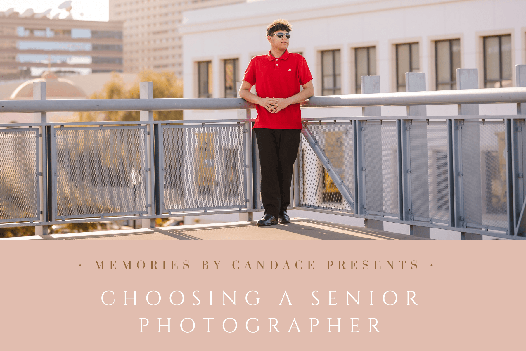 High school guy leaning on railing Downtown Phoenix during senior photo session.